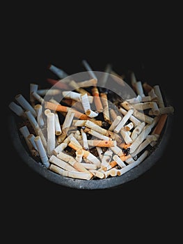 Close up ashtray in dark scene