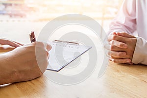 Close-up. Asian business of hand holding pen reviewing and signing,Home buying contract,Selective focus