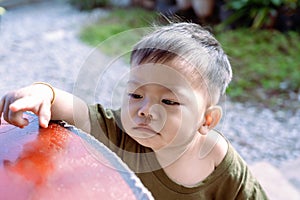 Close up of Asian child boy`s face with tears. Upset crying and mad little toddler boy.