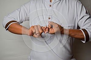 Close up Asian man shows hand gestures it means Friend isolated on white background. American sign language