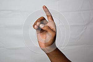 Close up Asian man shows hand gestures it means I beg Your Pardon isolated on white background