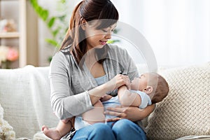 Close up of asian mother holding sleeping baby boy