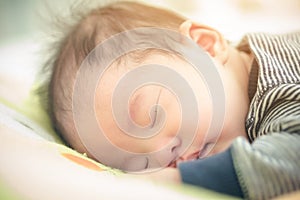 Close up asian newborn baby sleeping.