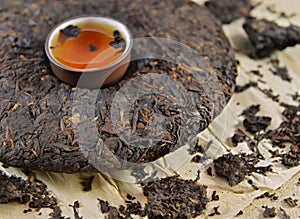 Close up of Asian Pu-erh tea with cup