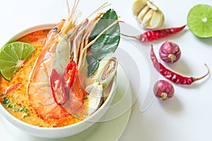 Close up Asian Spicy soup with shrimp in white bowl , famous Thai food cuisine calling Tom Yum Kung