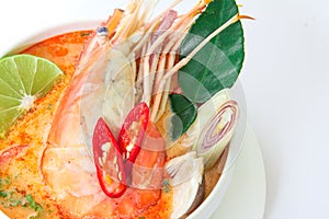 Close up Asian Spicy soup with shrimp in white bowl , famous Thai food cuisine calling Tom Yum Kung