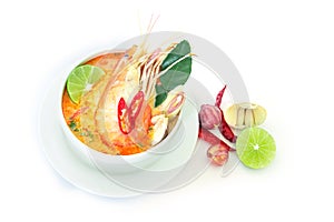 Close up Asian Spicy soup with shrimp in white bowl , famous Thai food cuisine calling Tom Yum Kung