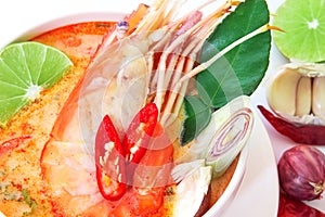 Close up Asian Spicy soup with shrimp in white bowl , famous Thai food cuisine calling Tom Yum Kung