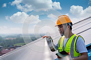 Close up asian technician checking the maintenance of the solar panels on roof, solar energy