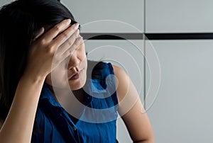 Close up of woman depression have a headache and feeling sadness in bedroom