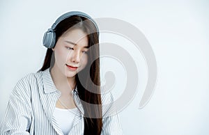 Close up of Asian woman portrait with headphones looking straight ahead