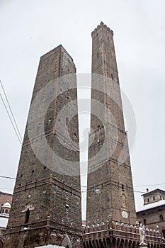 Close up. Asinelli tower of Bologna in the winter, coverd by snow