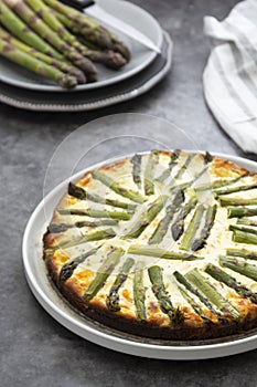 Close up asparagus tart. Healthy pie filled with fresh asparagus. Vegan food