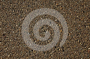 Close-up of asphalt with gravel inserted in it