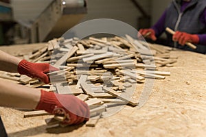 The close up of assembly workflow folded decorative untreated wood chips on table