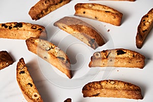 Close-Up of Assorted Almond, Hazelnut, and Cranberry Biscotti Arrayed on Pristine White Background