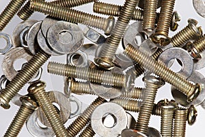 Assorted metal nuts and bolts isolated on a white background