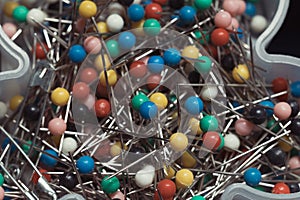 close up of assortment of colorful sewing pins