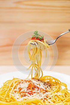Close-up of asta spaghetti with tomato sauce, olives and garnish photo