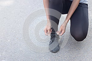 Close up Athlete running woman wearing Exercise pants and running shoe on the road,Runner woman traning in the morning.Walking for