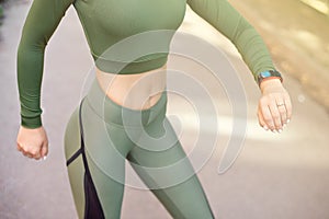 Close-up athletic female body slim elegant waist of a stylish fitness model with perfect figure lines after an effective