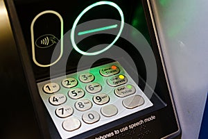 ATM contactless payment terminal with green light photo