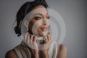 Close-up of an attractive african american woman portrait against grey wall