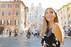 Close up of attractive beautiful woman in Piazza di Spagna square in Rome with Spanish Steps on the background
