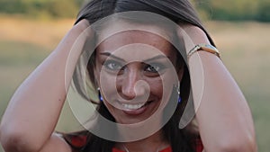 Close-up of attractive young woman smiling at camera