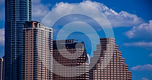 Close up on Austin Texas Office building Historic Skyline With New Austonian and Perfect Clouds and Blue sky