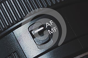 Close-up of the AF switch on the camera lens.