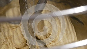 close up of automatic dough kneading at bread bakery