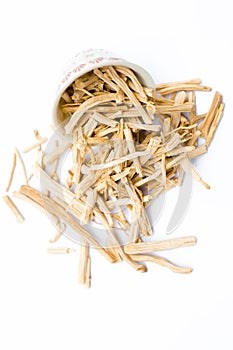 Close up of Ayurvedic herb Satavari or kurilo or Asparagus racemosus isolated on white in a glass bowl.