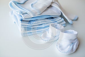 Close up of baby boys clothes for newborn on table