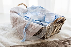 Close up of baby clothes for newborn boy in basket