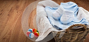Close up of baby clothes for newborn boy in basket