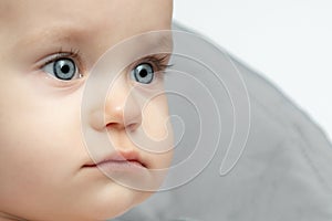 Close up of a baby face with blue eyes