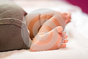 Close up baby foot. Tiny newborn baby foot. Happy family concept