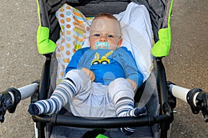 Close up of baby injury. Baby`s expression and the scar on the forehead after he hits his head on the ground