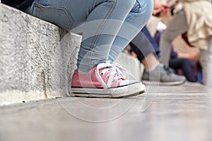 Close up from baby shoes sitten on stairs