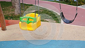 Close-up of a baby swing in the playground