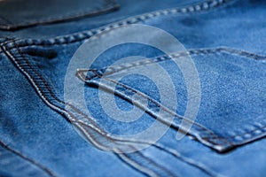 Close up Back blue jeans pocket denim background texture.