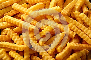 Close up background of crinkle cut fried chips photo