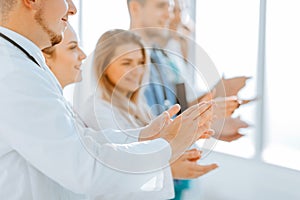 Close up. background image of an applauding group of medical professionals