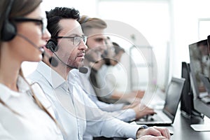 Close up.background image of call center employees in the workplace