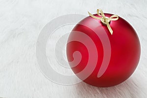 Close up background of one perfect big red Christmas ornament on white background horizontal with empty blank copy space