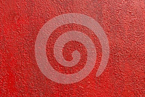 Close up background rough texture of abstract surface painted red