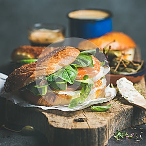 Close-up of bagel with salmon, cream-cheese, vebegables and coffee espresso