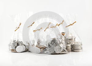 Close up bags of coins on white background for financial and saving artwork