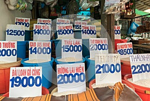 Close up of bags of rice in a local market in Vietnam with price